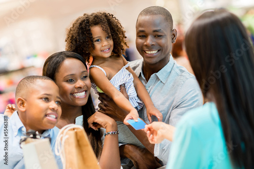 Photo: Shopping family at the cashier Shopping family at the cashier