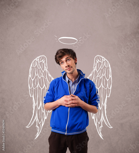Photo: Young man with angel illustrated wings Young man with angel illustrated wings