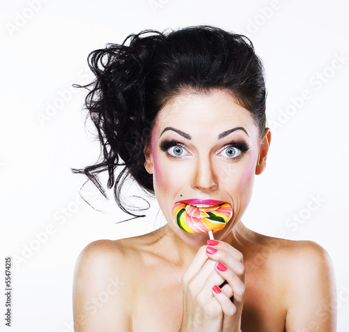 Photo: Ecstasy. Funny Peppy Woman with Yummy Lollipop Ecstasy. Funny Peppy Woman with Yummy Lollipop