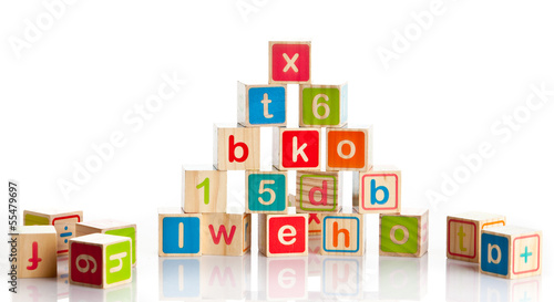 Photo: wooden toy cubes with letters. Wooden alphabet blocks. wooden toy cubes with letters. Wooden alphabet blocks.