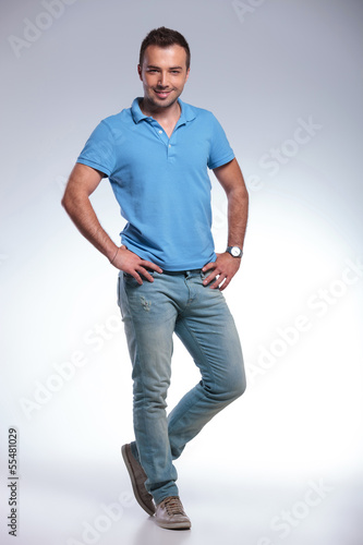 Photo: casual man stands with hands on hips casual man stands with hands on hips