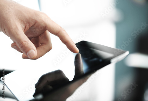 Photo: hand pusning touch pad hand pusning touch pad