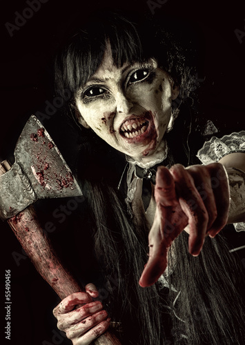 Photo: Female zombie with bloody axe Female zombie with bloody axe