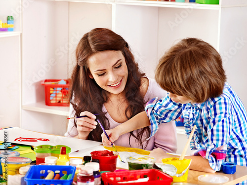 Photo: Family with child painting . Family with child painting .