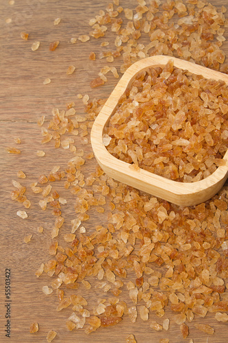 Photo: Organic rock candy sugar in wooden bowl Organic rock candy sugar in wooden bowl