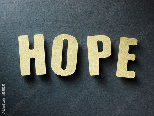 Photo: The word Hope on paper background The word Hope on paper background