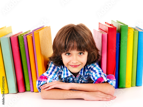 Photo: Child with stack of books. Child with stack of books.
