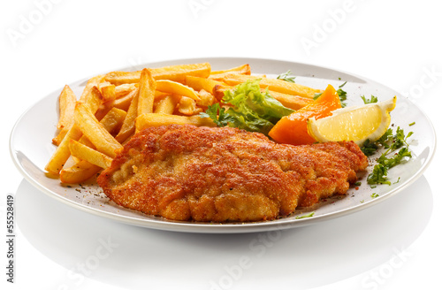 Photo: Pork chop, French fries and vegetables Pork chop, French fries and vegetables