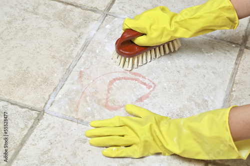 Photo: scrubbing the tiles scrubbing the tiles