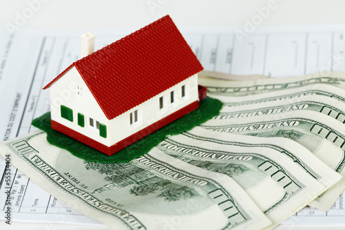 Photo: Family house and money. Family house and money.