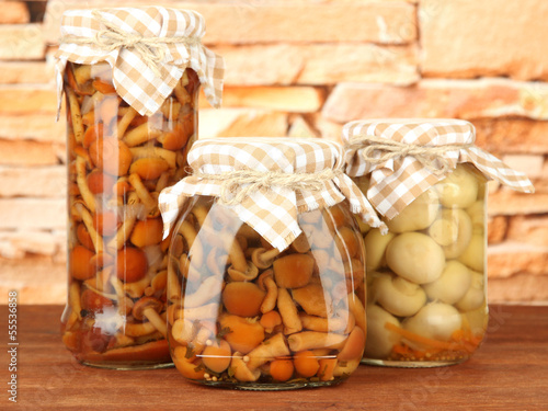 Photo: Delicious marinated mushrooms in glass jars, Delicious marinated mushrooms in glass jars,
