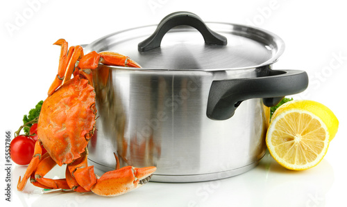 Photo: Composition with boiled crab, pan and vegetables isolated Composition with boiled crab, pan and vegetables isolated
