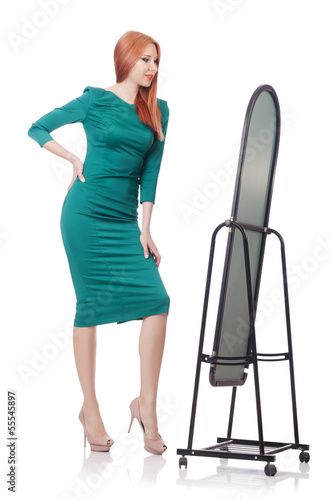 Photo: Woman trying new clothing on white Woman trying new clothing on white