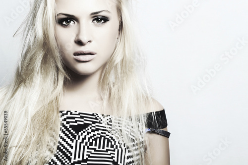 Photo: Beautiful fashion blond woman with disheveled hair.make-up Beautiful fashion blond woman with disheveled hair.make-up