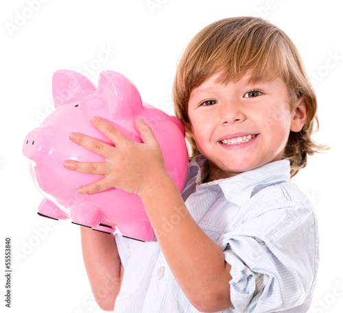 Photo: Boy holding a piggybank Boy holding a piggybank