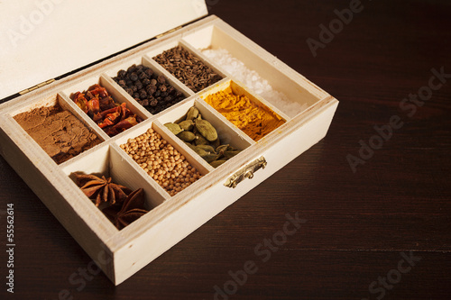 Photo: Wooden box full of spices, left aligned Wooden box full of spices, left aligned