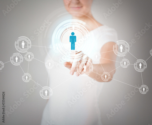 Photo: businesswoman pressing button with contact businesswoman pressing button with contact