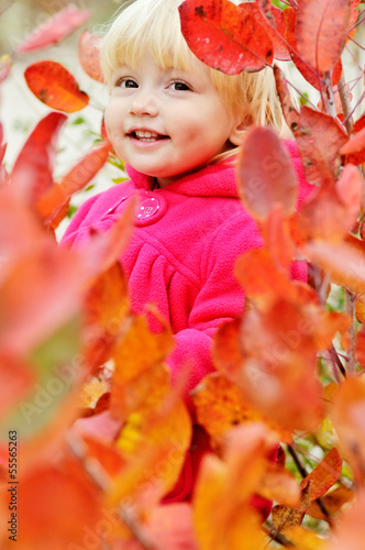 Photo: toddler girl standing in bushes toddler girl standing in bushes
