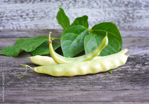 Photo: Yellow kidney beans on old wooden table Yellow kidney beans on old wooden table