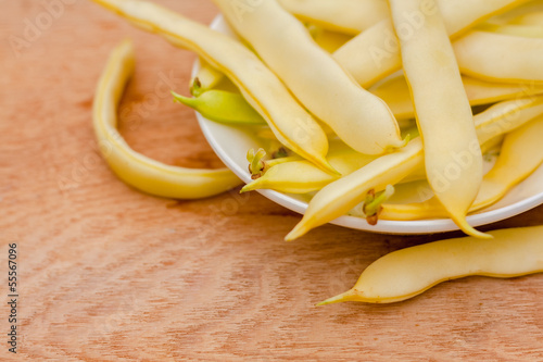 Photo: Yellow Kidney Beans In A Bowl On Wooden Table Yellow Kidney Beans In A Bowl On Wooden Table