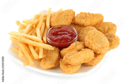 Photo: Fried chicken nuggets with french fries and sauce isolated Fried chicken nuggets with french fries and sauce isolated