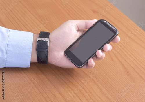 Photo: Man holding a Smart Phone Man holding a Smart Phone