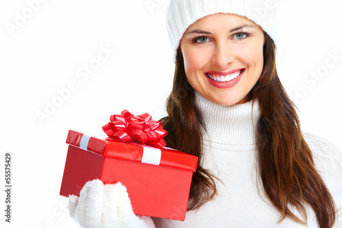 Photo: Beautiful young Christmas girl with gift. Beautiful young Christmas girl with gift.