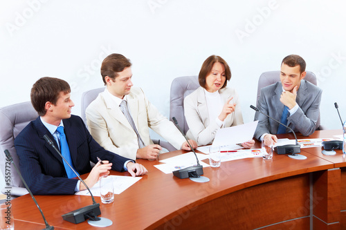 Photo: Four businesspeople at meeting Four businesspeople at meeting
