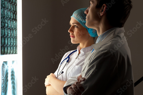 Photo: Two doctors examining x-ray results Two doctors examining x-ray results