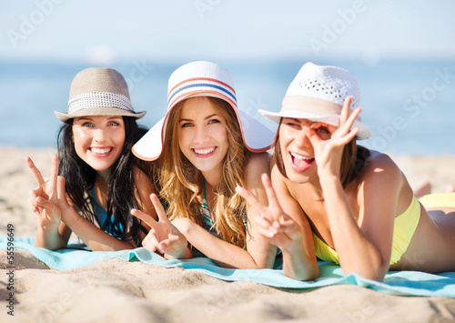 Photo: girls sunbathing on the beach girls sunbathing on the beach