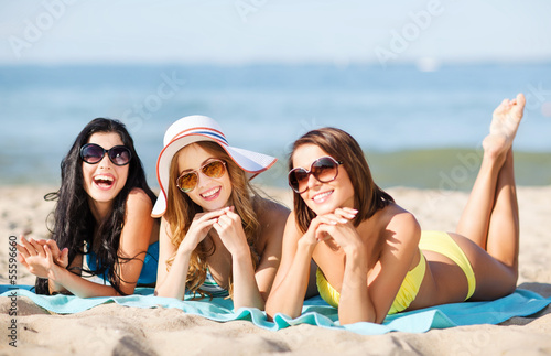Photo: girls sunbathing on the beach girls sunbathing on the beach