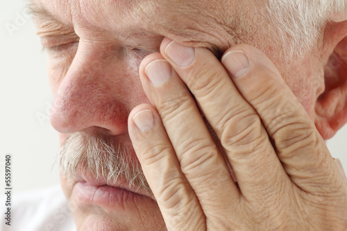 Photo: senior man has eyestrain and fatigue senior man has eyestrain and fatigue