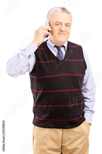 Photo: Smiling gentleman talking on a mobile phone Smiling gentleman talking on a mobile phone
