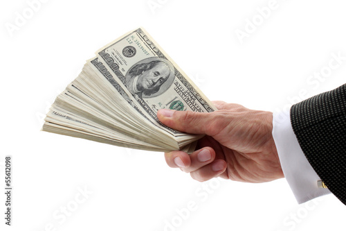 Photo: hand holding fan-shaped dollars hand holding fan-shaped dollars
