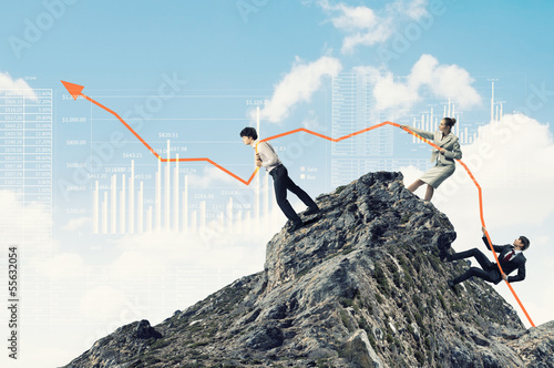 Photo: Businesspeople pulling graph Businesspeople pulling graph