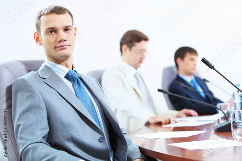Photo: Three businesspeople at meeting Three businesspeople at meeting