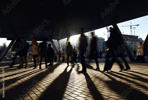Photo: People walking near the metro station. People walking near the metro station.
