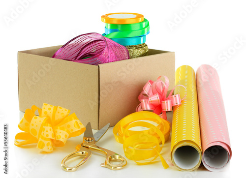 Photo: Materials and accessories for wrapping gifts isolated on white Materials and accessories for wrapping gifts isolated on white