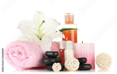 Photo: Beautiful spa setting with lily isolated on white Beautiful spa setting with lily isolated on white