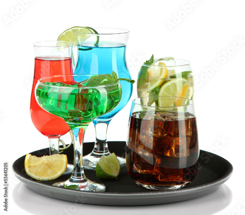 Photo: Many glasses of cocktails on tray, isolated on white Many glasses of cocktails on tray, isolated on white