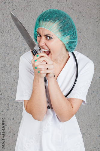 Photo: Evil doctor with huge knife Evil doctor with huge knife
