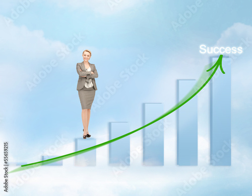 Photo: businesswoman with big 3d chart businesswoman with big 3d chart