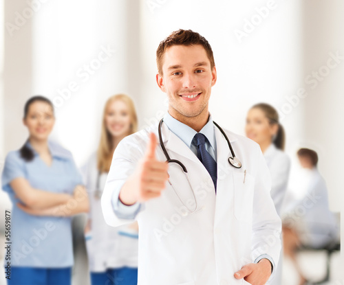 Photo: doctor with stethoscope showing thumbs up doctor with stethoscope showing thumbs up