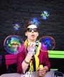 woman blowing soap bubbles woman blowing soap bubbles
