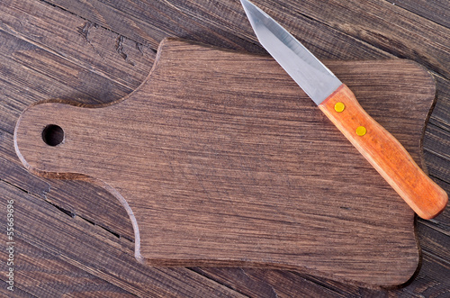 Photo: knife on wooden board knife on wooden board