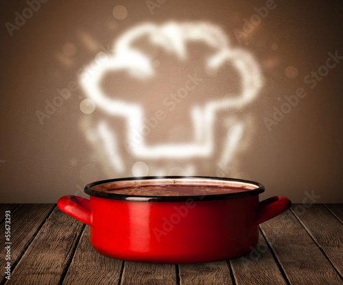 Photo: Chef hat above cooking pot Chef hat above cooking pot