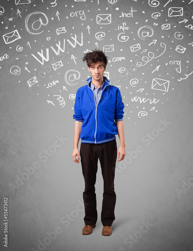 Photo: Casual young man with abstract white media icon doodles Casual young man with abstract white media icon doodles