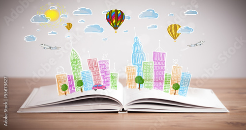 Photo: cityscape drawing on open book cityscape drawing on open book