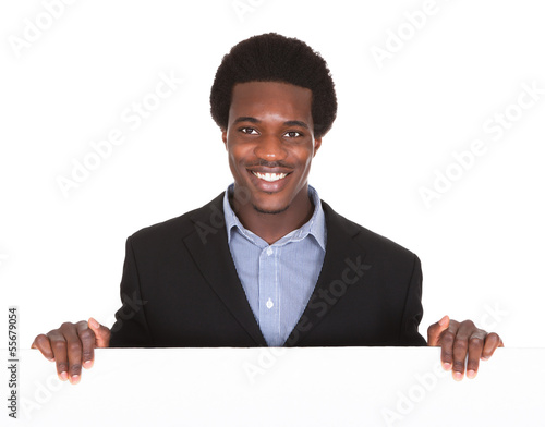 Photo: African Businessman With Placard African Businessman With Placard