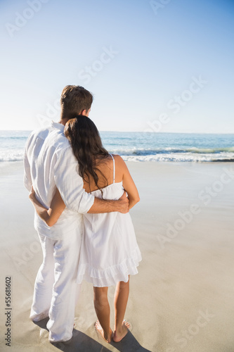 Photo: Content couple looking at the waves Content couple looking at the waves